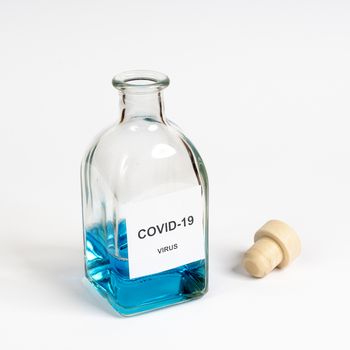 A glass bottle containing the  COVID 19 Corona virus