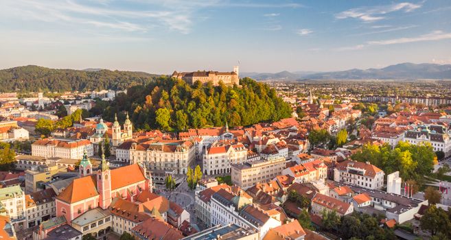 Aerial panoramic view of Ljubljana, capital of Slovenia in warm afternoon sun.