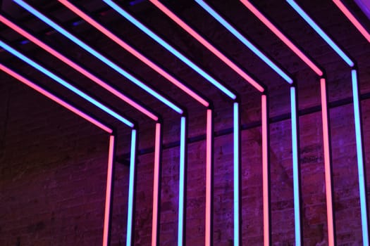 Neon red and blue lights stone wall background