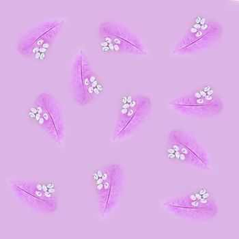 Seamless texture of pink feather and eggs on a pink background. Easter concept