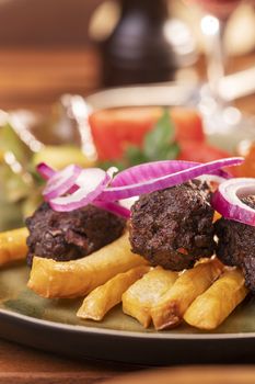 closeup of cevapcici with french fries