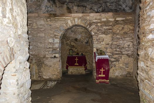 Inside the monastery enclosed by Davelis cave in Penteli, a mountain to the north of Athens, Greece.