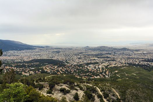 Panoramic view of cloudy Athens, taken shot from Penteli mountain. Greece.