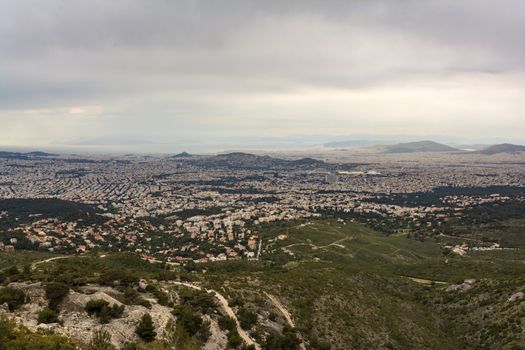 Panoramic view of cloudy Athens, taken shot from Penteli mountain. Greece.