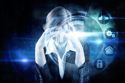 Redhead businesswoman with head in hands against black technology interface with glow