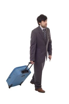 Full length side view of young businessman with luggage walking isolated on white background