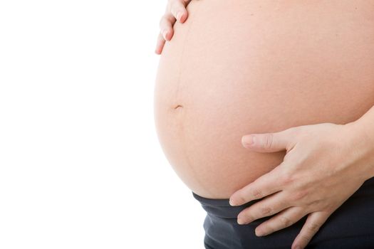 Closeup of pregnant woman at white background