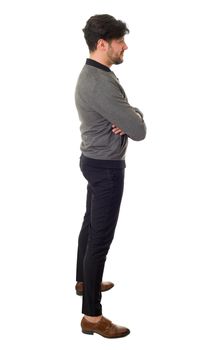 young casual man full body from the side in a white background