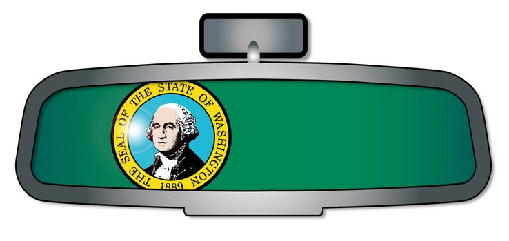 A vehicle rear view mirror with the flag of the state of Washington