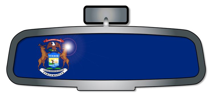 A vehicle rear view mirror with the flag of the state of Michigan