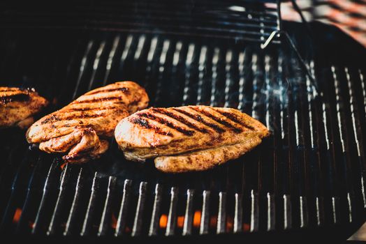 Chicken filet on barbeque grill