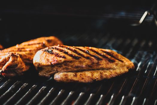 Chicken filet on barbeque grill