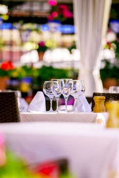 Wineglasses on restaurant table. Selective focus.