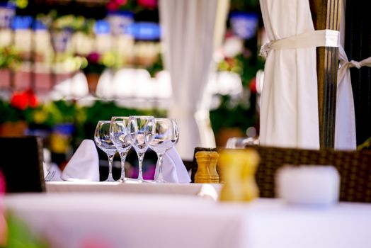 Wineglasses on restaurant table. Selective focus.