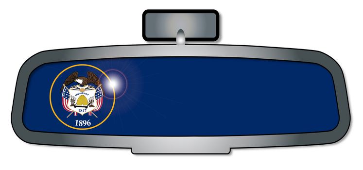 A vehicle rear view mirror with the flag of the state of Utah