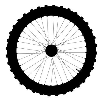 A knobly tyre on a bicycle wheel with valve and spoke nipples in silhouette