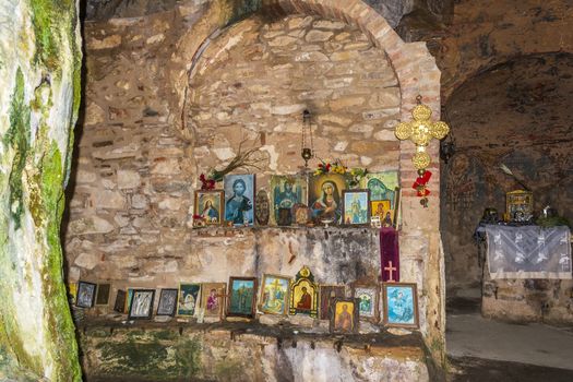 Inside the monastery enclosed by Davelis cave in Penteli, a mountain to the north of Athens, Greece.