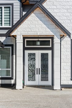 Entrance of luxury residential house on bright sunny day