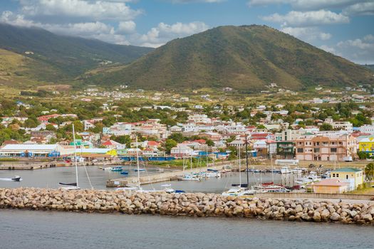 Stone seawall and protected harbor on the coast of St Kitts