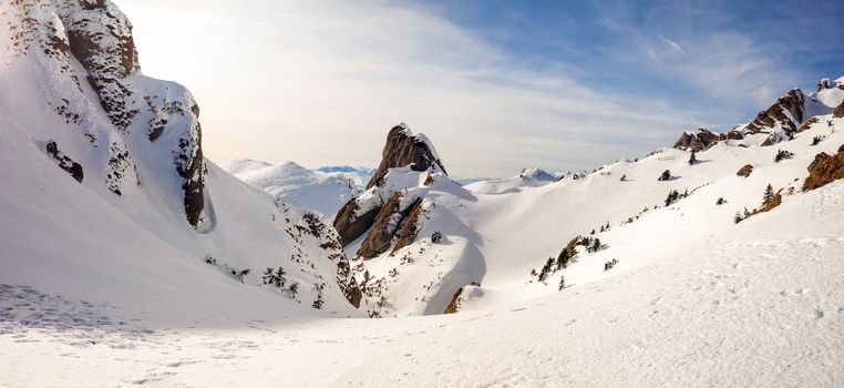 Panoramic view of Mount Ciucas peak at a sunset on winter, part of Romanian Carpathian Range