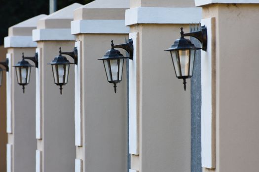 A residential home outer perimeter security wall with lantern lights, Mossel Bay, South Africa