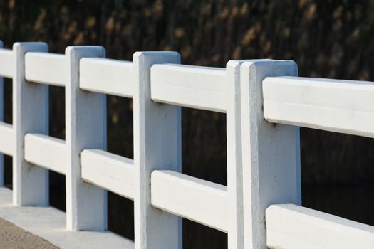 Solid concrete guardrail on a roadside sidewalk bridge crossing, Mossel Bay, South Africa