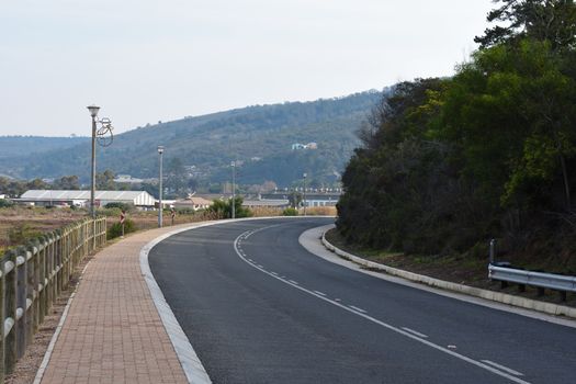 Driveway with sidewalk going into town at Great Brak River, Mossel Bay, South Africa