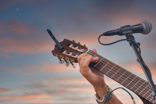 A guitarist working the fretboard isolated on white