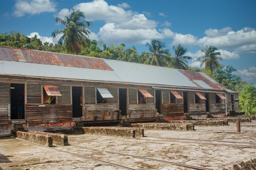 Old warehouse of rough, weathered lumber with corrugated tin roof