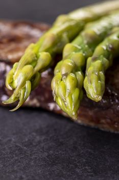 green asparagus on a steak