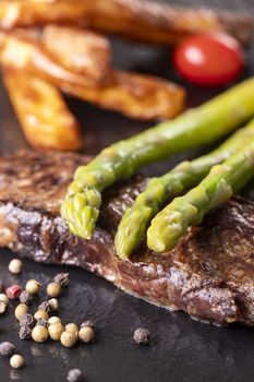 green asparagus on a steak