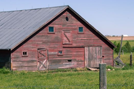 An old barn in a field. High quality photo