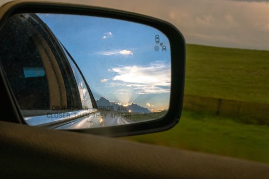 A side view mirror of a car. High quality photo