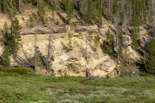 A sign on the side of a mountain. High quality photo