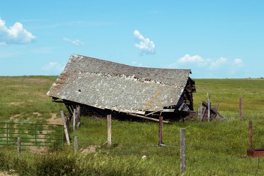 An old barn in a field. High quality photo