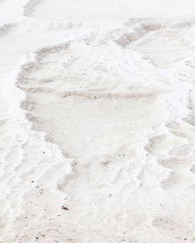 The view across a white travertine terrace in Pamukkale, southwestern Turkey.  The site is a UNESCO World Heritage Site.