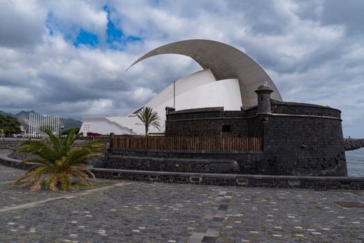 Santa Cruz de Tenerife, Spain -January 9, 2020:  Auditorio de Tenerife and San Juan Baptist Castle (Black Castle). Santa Cruz de Tenerife.