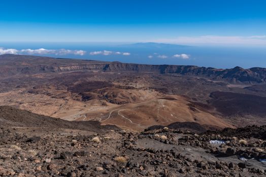 View from Teide то Las Canadas Caldera volcano with solidified lava and Montana Blanca mount. Teide national Park, Tenerife, Canary Islands, Spain.