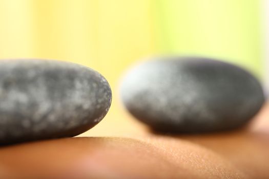 close up of body parts of a woman at wellness center with yellow background