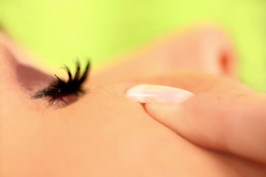 close up of body parts of a woman at wellness center with yellow background