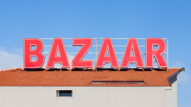 A signpost highlights the location of a local bazaar in southern Turkey.