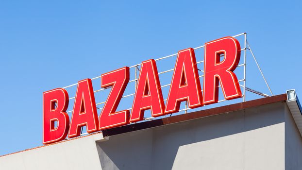 A signpost highlights the location of a local bazaar in southern Turkey.