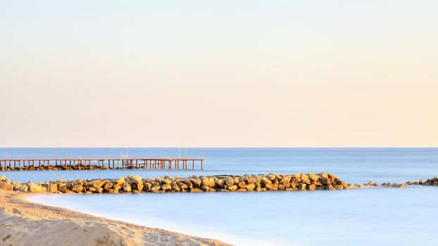 A long exposure of dusk over the Mediterranean Sea viewed from the southern Turkish coastline near Turkler.