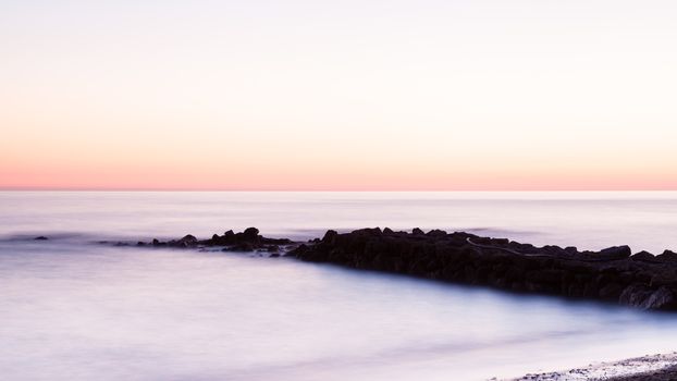 A long exposure of a Mediterranean sunset taken from the Turkish coastline near Turkler.