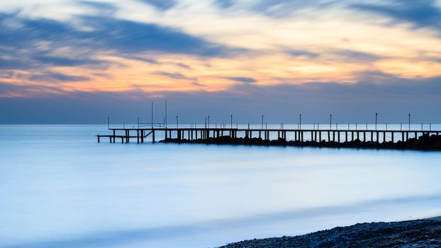 A long exposure of dusk over the Mediterranean Sea viewed from the southern Turkish coastline near Turkler.