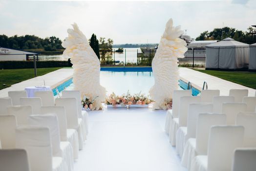 wedding ceremony area, arch chairs decor