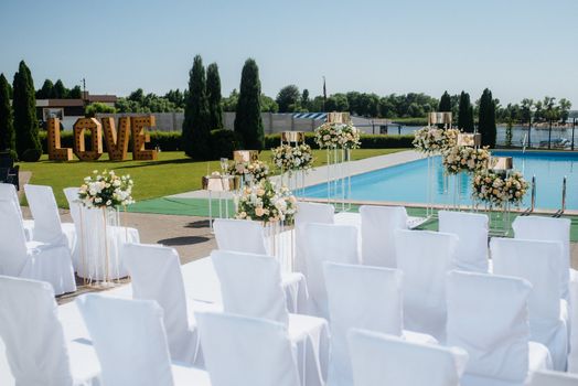 wedding ceremony area, arch chairs decor