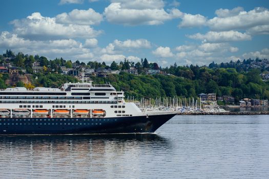 Front half of a blue and white cruise ship on coast of Washington