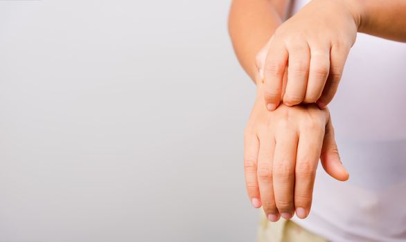 Asian beautiful woman itching her useing hand scratch itch hand on white background with copy space, Medical and Healthcare concept