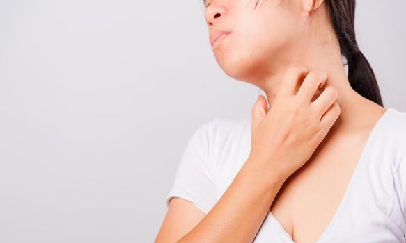 Asian beautiful woman itching her useing hand scratch itch neck on white background with copy space, Medical and Healthcare concept